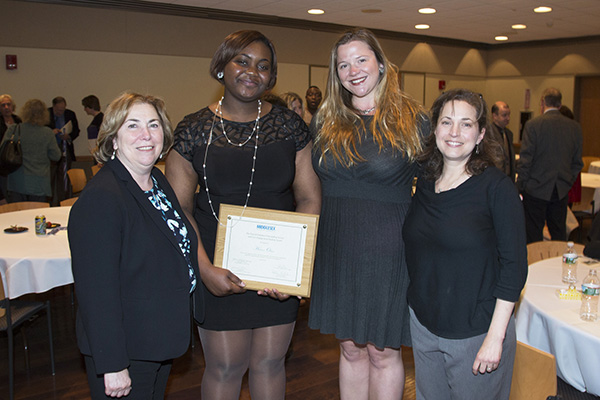 From left: College President Joann La Perla-Morales, Halimat Oshun, Pattiann McMahon, faculty advisor to Democracy House, and Jennifer Altman, former faculty advisor and chair of the award selection committee.
