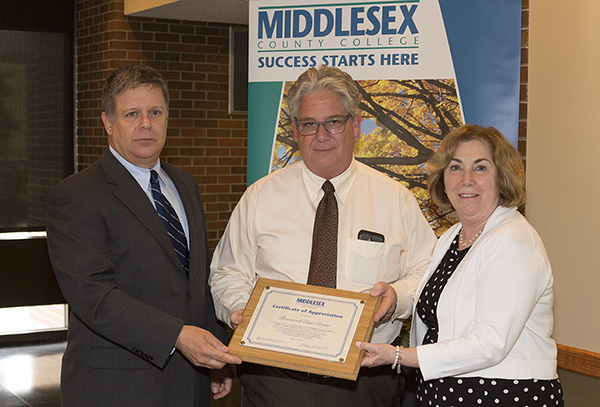 From left, Martin Schamberger, allied health grant coordinator at MCC; Frank Damiani, director of patient care at Roosevelt Care Center; and Joann La Perla-Morales, College president.